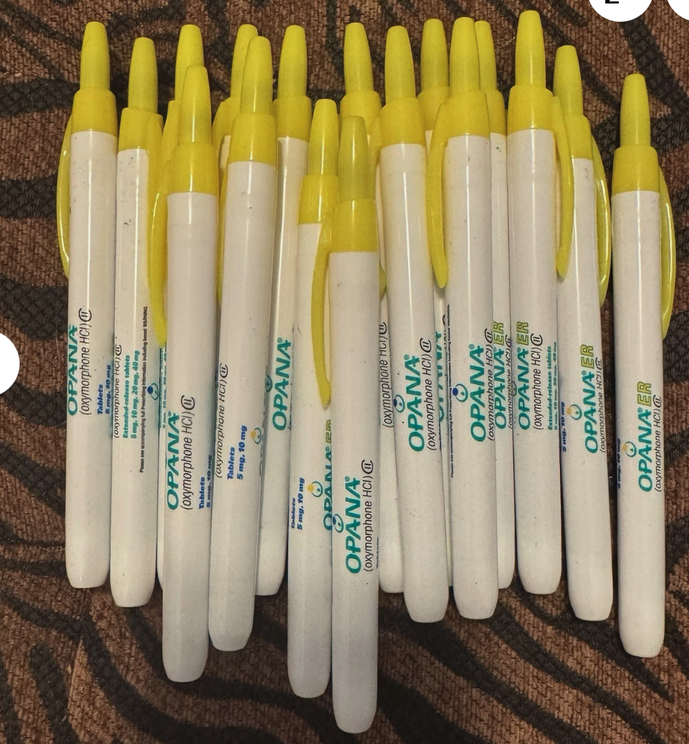 A lot of vintage white Opana ER promotional highlighters with yellow chisel caps